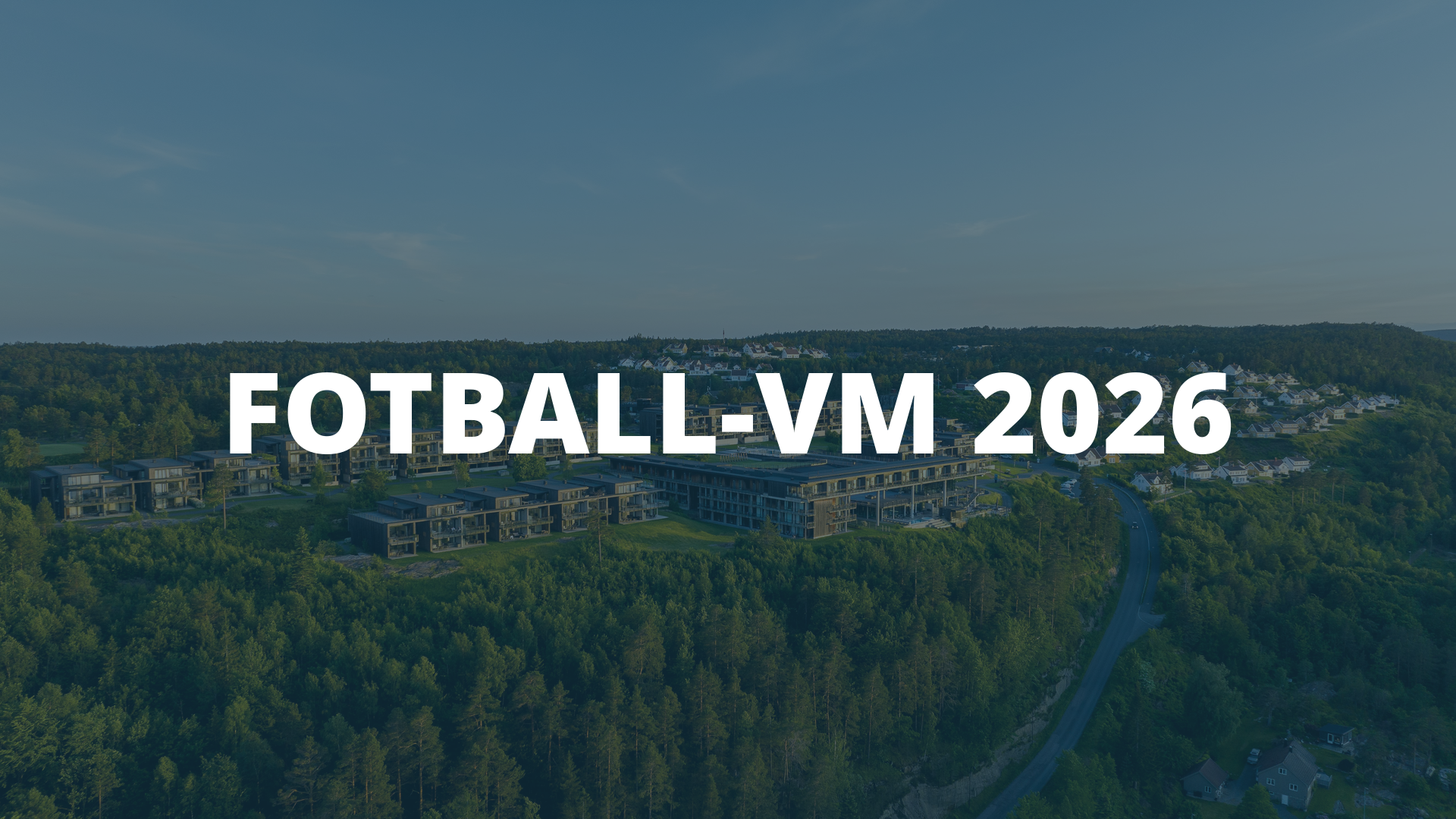 Aerial view of a forested residential area with bold white text reading 'FOTBAL-VM 2026' across the centre, acting as a banner.